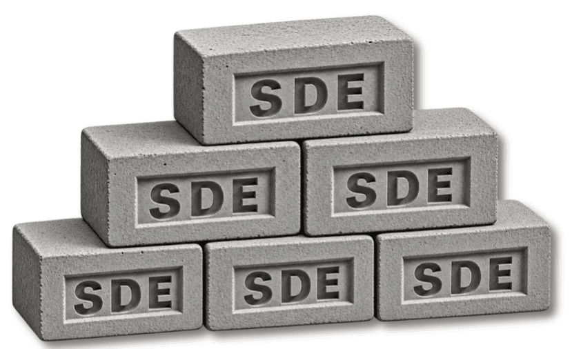 SDE fly ash bricks stacked, showing the embossed SDE face